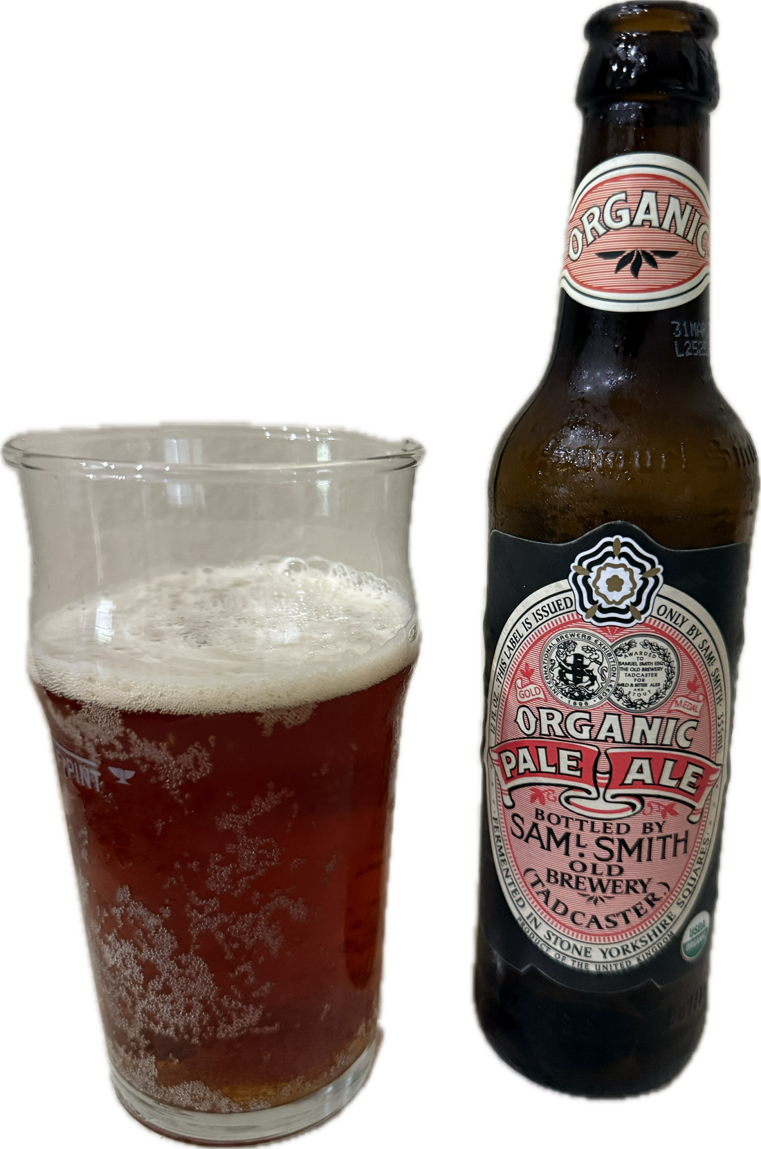 Samuel Smith Organic Pale Ale in a tulip glass beside the bottle — golden amber, creamy white head, Old Brewery Tadcaster label